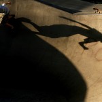 Sixteen year old Adam Medsker drops into the bowl Tuesday evening as his friend looks on Tuesday afternoon at Terrell Mill Skate Park in Iowa City.